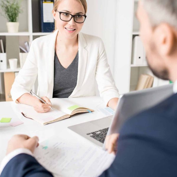 Smiling-Business-Consultant-Talking-To-Entrepreneur.jpg